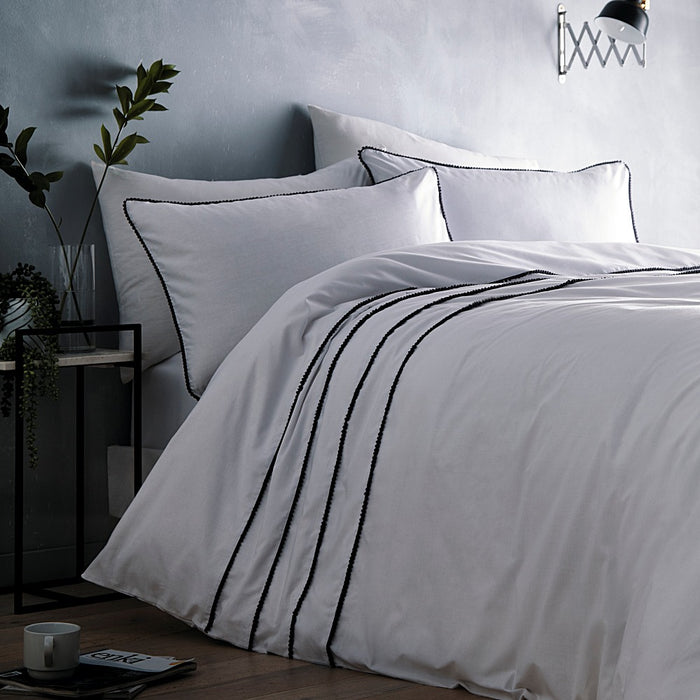 A bedroom setting with a double bed and Casper duvet set