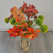 A realistic faux green and orange stem of chokeberry leaves in a bouquet
