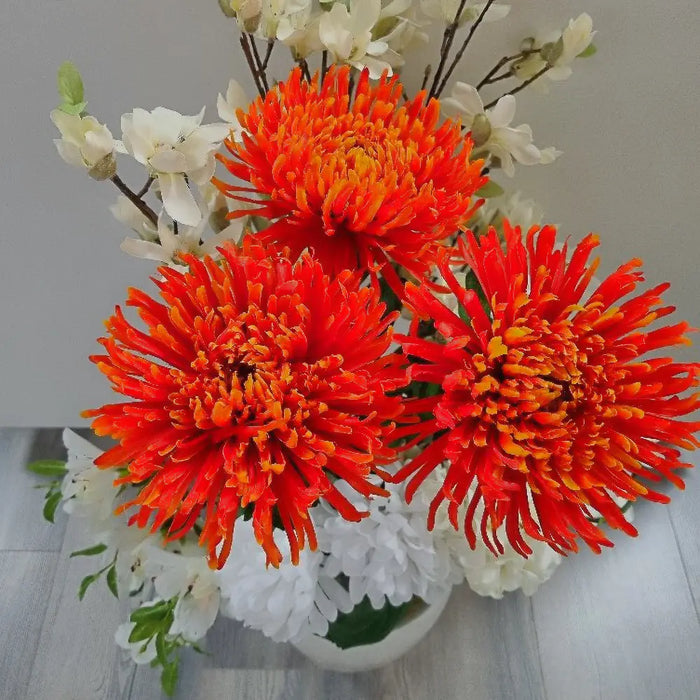 Artificial orange chrysanthemum in a bouquet