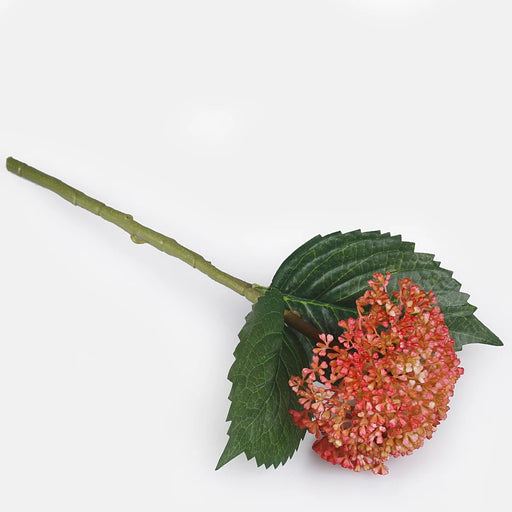Artificial coral hydrangea seeds on stem with green leaves