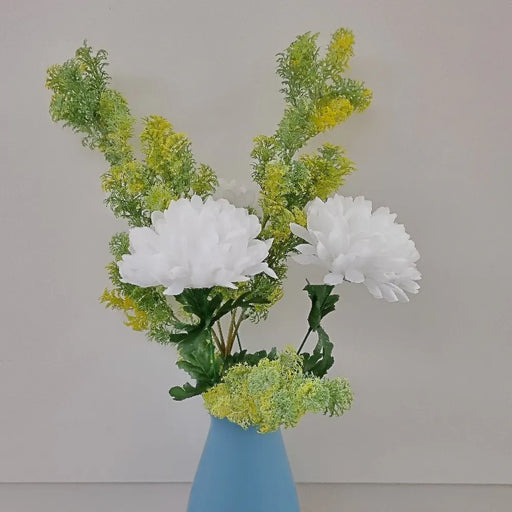 Artificial green and yellow cypress stem in a bouquet