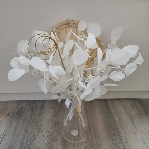 White artificial eucalyptus stem in a bouquet