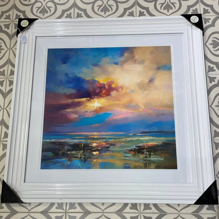 An idyllic abstract ocean setting print in a white frame