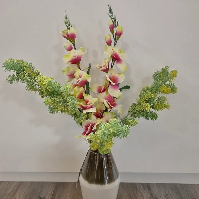 The Gladiolus twig of beautiful pink and cream satin flowers, in a bouquet