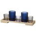 A collection of 5 navy and black glass tealight holders with a wooden tray