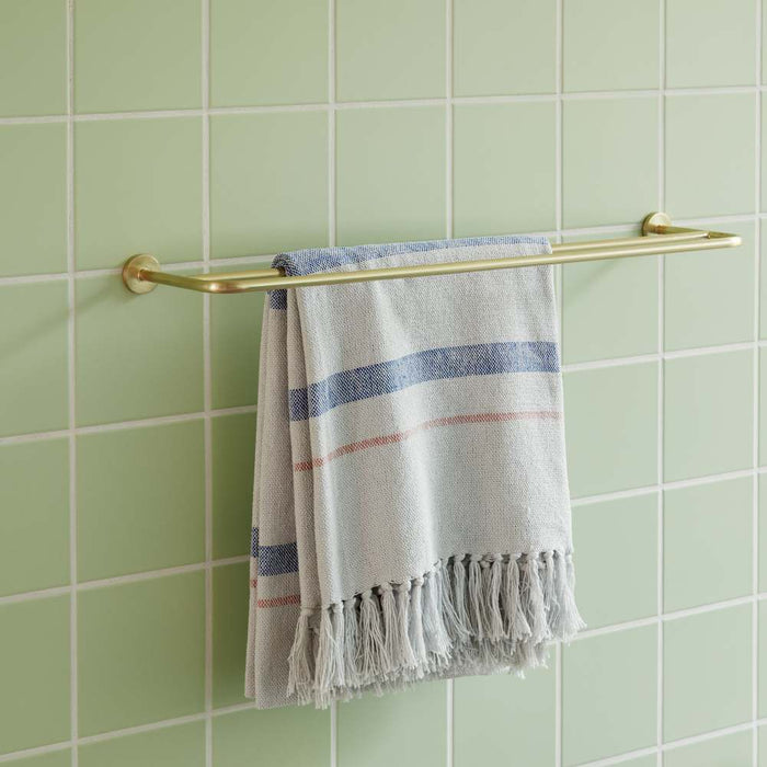 HUBSCH brass metal towel holder in bathroom 