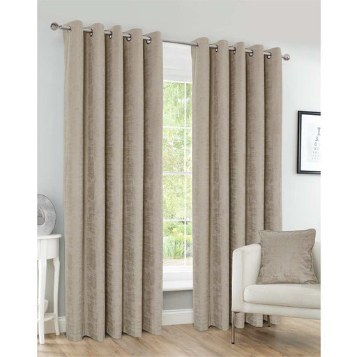 A living room window with Harris Corn distressed faux velvet, textured curtains