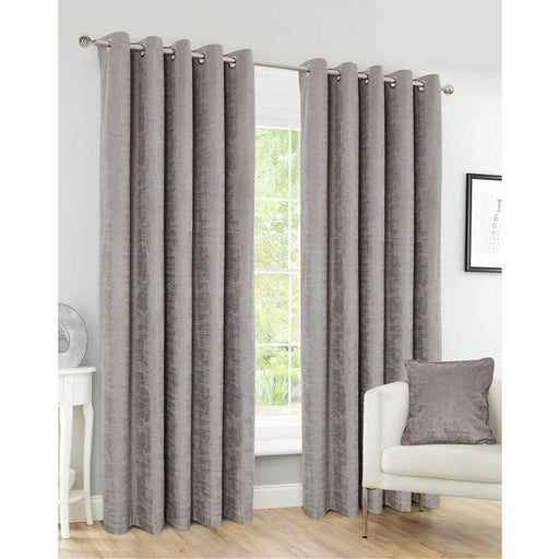 A living room window with Harris Flint distressed faux velvet, textured curtains