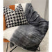 A delicate, snug black, grey and natural large acrylic throw by Hübsch
