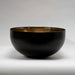 Mixology large decorative bowl featuring a combination of black and warm metallic tones
