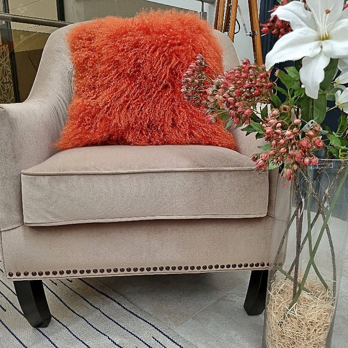 A soft, textured, Tibetan lambswool mongolian orange cushion, with a real suede back