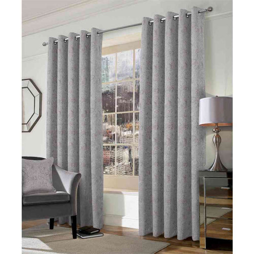 A living room window with Muse ash, geo style woven curtains