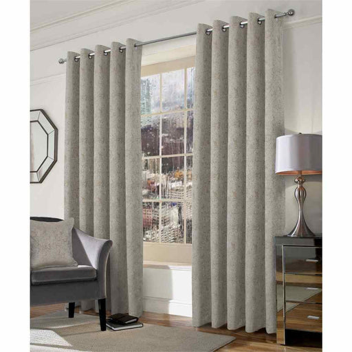 A living room window with Muse honey, geo style woven curtains