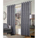 A living room window with Muse platinum, geo style woven curtains