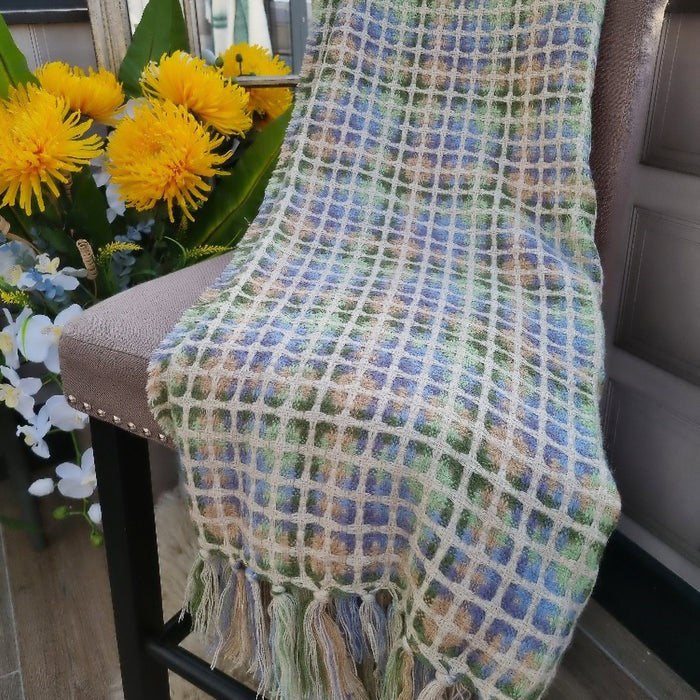 Textured woven Mustique throw with multi-coloured threads