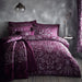 A bedroom setting with a double bed and Oak Tree Plum duvet set