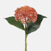 Artificial pink hydrangea seeds on stem with green leaves