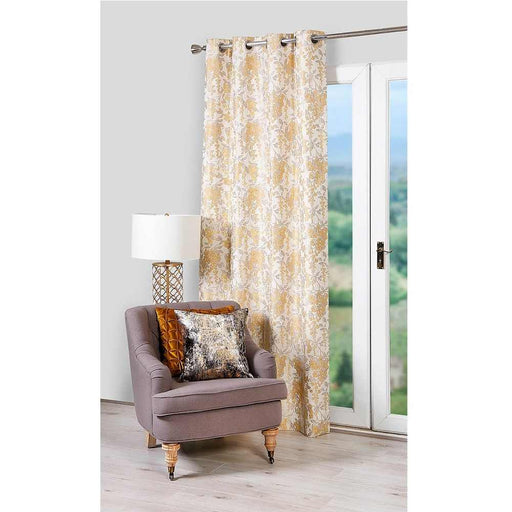 A living room window with Scatter Box Camille Ochre floral design curtains
