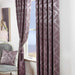 A living room window with Scatter Box Darwin heather, damask design curtains