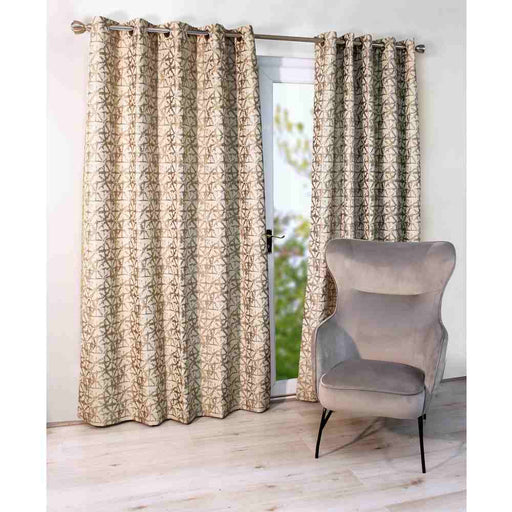 A living room window with Scatter Box Sigma grey, damask design curtains