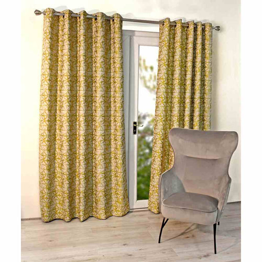 A living room window with Scatter Box Sigma yellow, damask design curtains