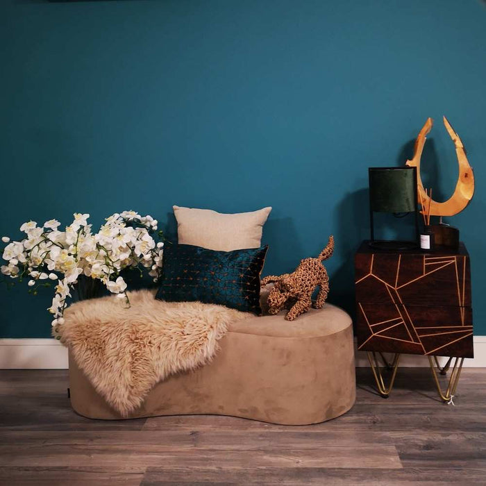 A living room setting with pouffe and Scatter Box Jasper cushion featuring a sumptuous diamond teal & gold design finished with a gold velvet reverse