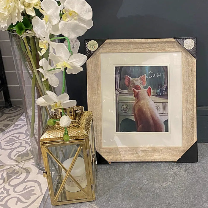 A charming print of an admiring piglet in an antique white frame