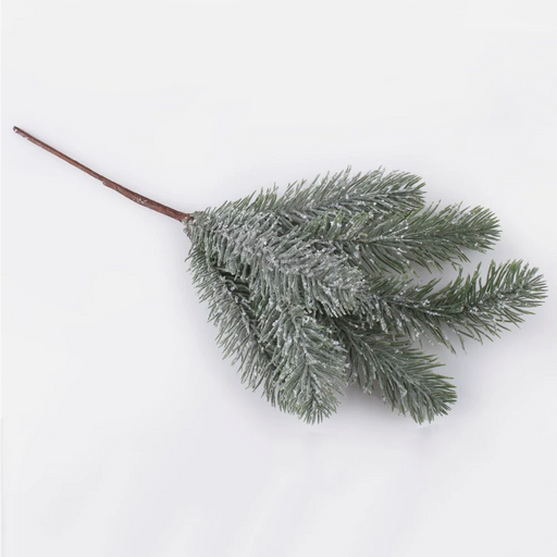 Snow covered artificial spruce twig