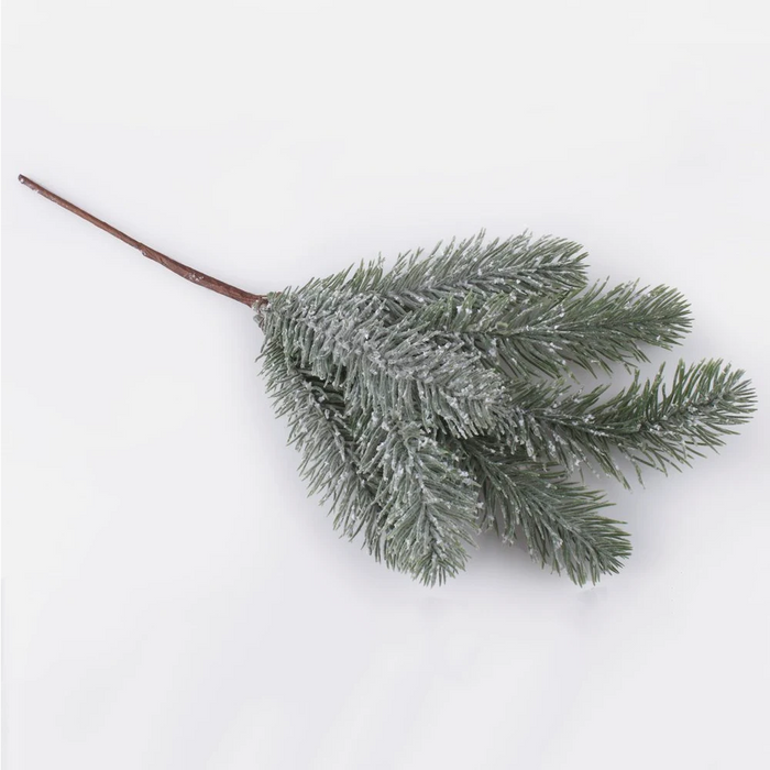 Snow covered artificial spruce twig