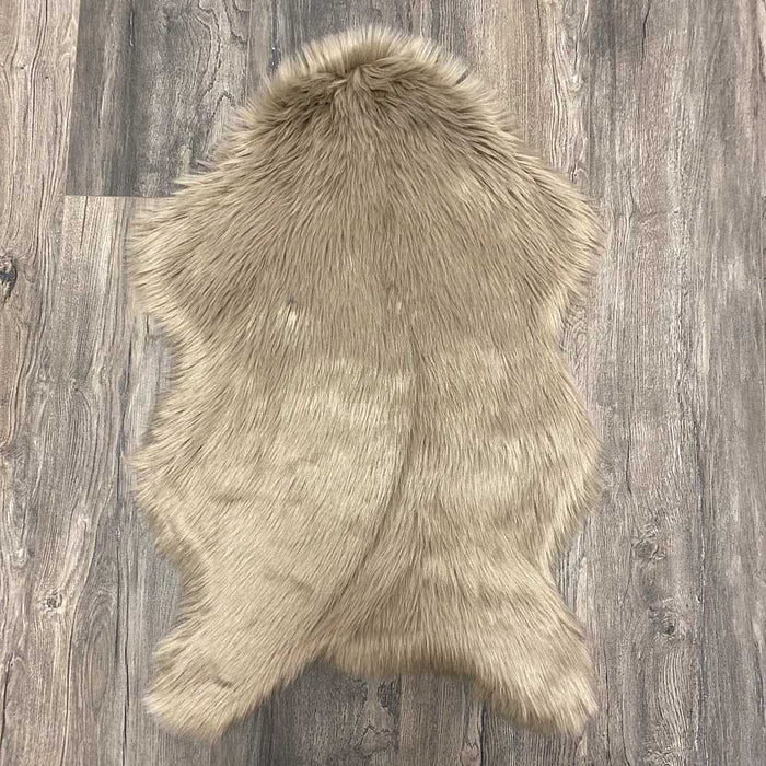 Irresistibly tactile faux sheepskin snug taupe rug