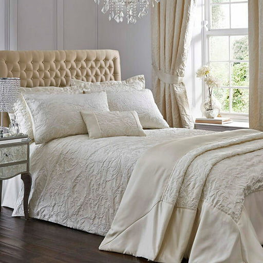 A bedroom setting with a double bed and Spencer Ivory duvet set