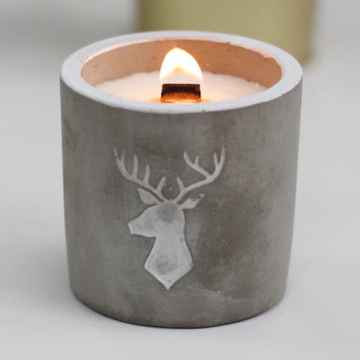 Whiskey & woodsmoke wooden wick soy candle in a stags head emblazoned concrete jar