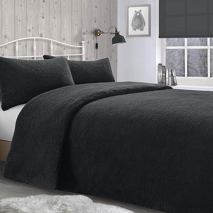 A bedroom setting with a double bed and Teddy Charcoal duvet set