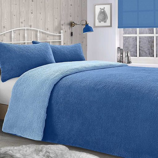 A bedroom setting with a double bed and Teddy French Blue duvet set