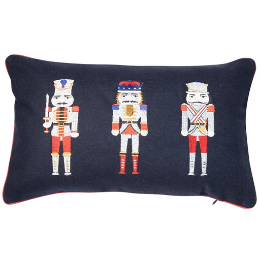 Embroidery toy soldiers on a navy cushion with red edging