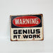 "Warning, Genius at Work", decorative metal hanging sign