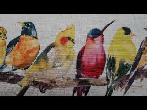 Sunita cushion featuring a dawn chorus of colourful birds