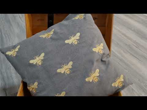 Abeja Cushion with golden bees embroidered all over this grey cushion